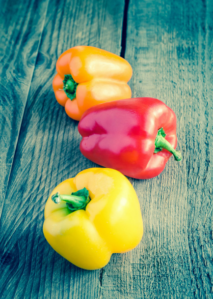 Bell peppers on the wooden background - Photo, Image