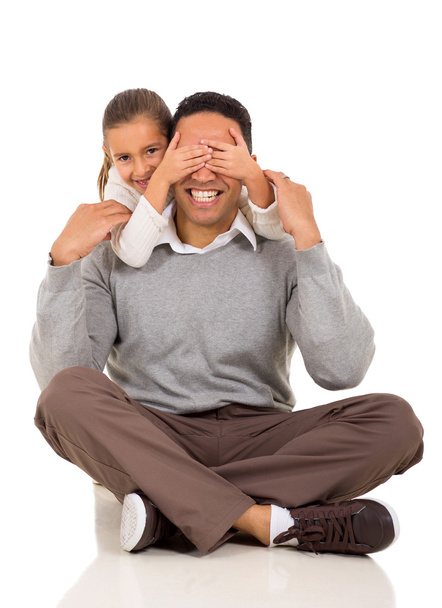 Little girl covers her dad's eyes - Фото, зображення