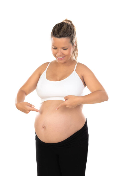Pregnancy. Happy pregnant woman isolated on a white background - Zdjęcie, obraz