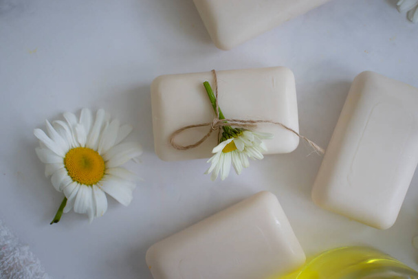 natural soap, chamomile flower on a light background - Zdjęcie, obraz