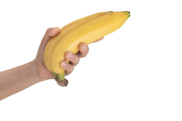 kézzel tart banán. elszigetelt fehér background. - Fotó, kép