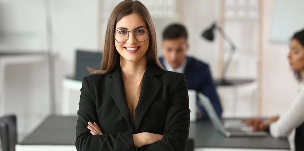 Pretty young businesswoman during meeting in office - Photo, image