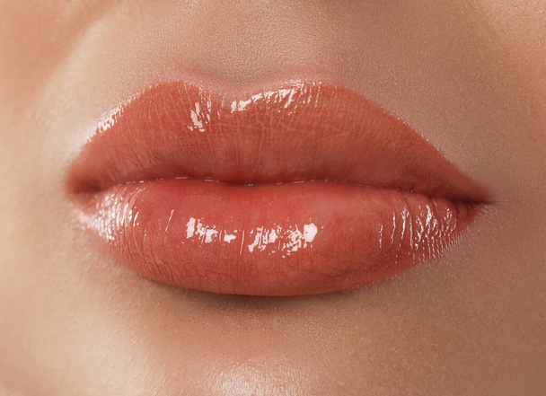Woman with beautiful perfect lips after permanent makeup procedure, closeup - Foto, imagen