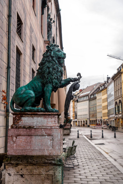 Lion statue at Odeonsplatz where significant structures like Feldherrnhalle, Palais Preysing, St. Cajetan Church etc. are located, Munich, Germany. - Valokuva, kuva