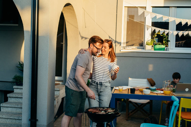 happy family barbecue in their backyard - Фото, зображення