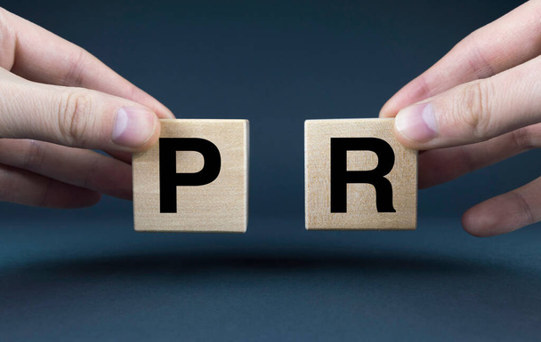 PR. Cubes form the words PR Public Relations. Public relations concept - Photo, Image