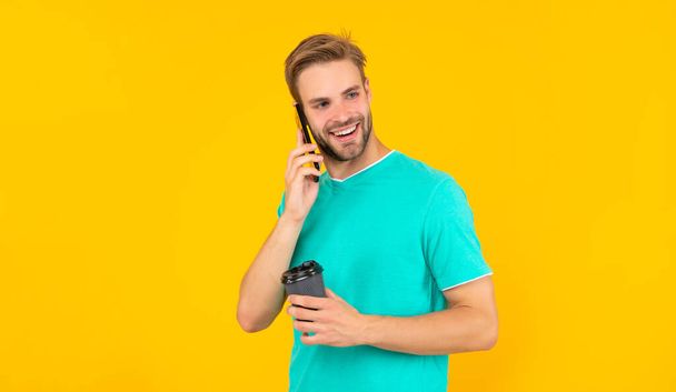 telephone connection. young man talk on cellphone. phone call communication. mobile technology. smiling man speak on smartphone. guy has conversation. voice contact. - Fotoğraf, Görsel