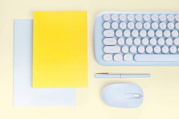 flat lay yellow book and blue stationery on yellow  background - Photo, image