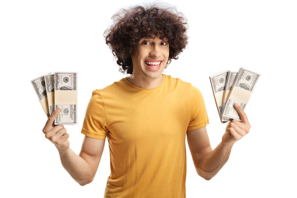Smiling guy showing cash in front of camera isolated on white background - Zdjęcie, obraz