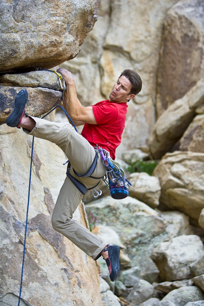 Rock climber dangling from a cliff. - Photo, Image