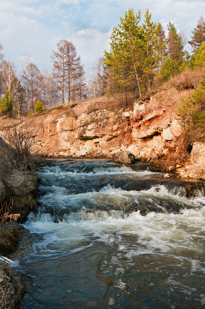 Streaming water in a small river at early springtime. - Photo, image