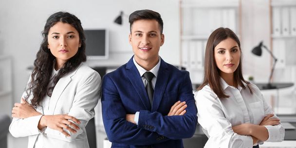 Young business people with crossed arms in office - Photo, Image