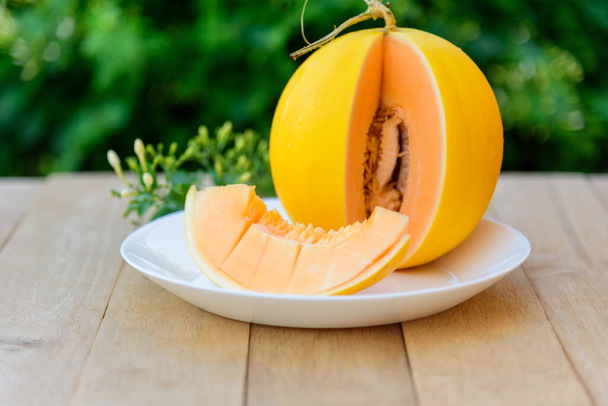 fresh sweet golden melon in white dish - Foto, Imagem