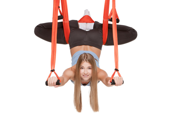 Young woman making antigravity yoga exercises in stretching twine - Fotoğraf, Görsel