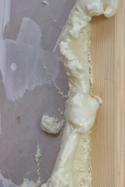 Polyurethane foam around the door frame 2 - Photo, Image