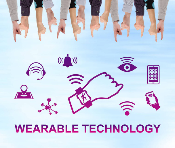 Wearable technology concept pointed by several fingers - Photo, Image