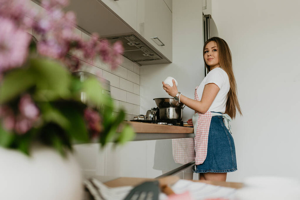 Young Woman Cooking in the kitchen. Healthy Food. Dieting Concept. Healthy Lifestyle. Cooking At Home. Prepare Food - Photo, Image