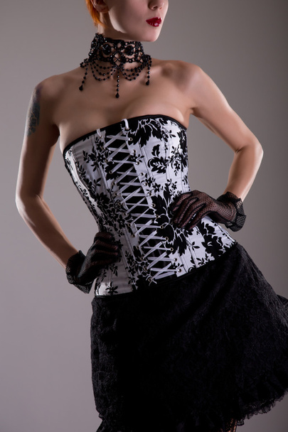 Woman in black and white corset - Фото, изображение