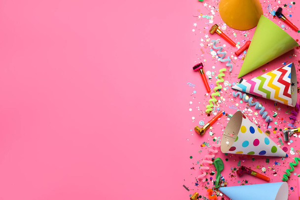 Beautiful flat lay composition with festive items on pink background, space for text. Surprise party concept - Foto, Bild