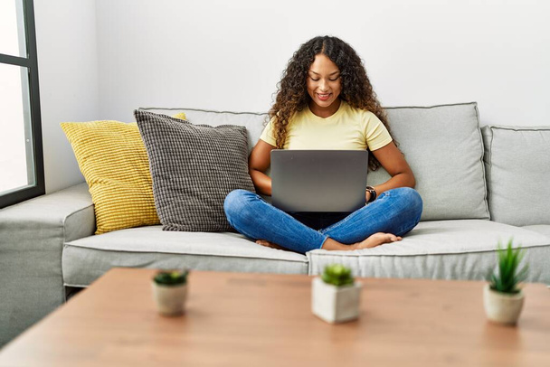 Young latin woman smiling confident using laptop at home - Φωτογραφία, εικόνα