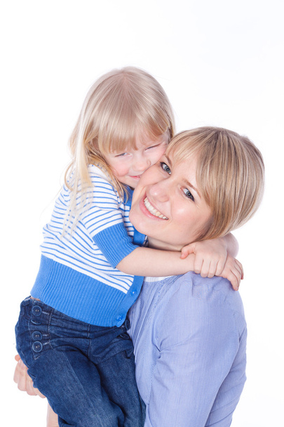 Happy smiling mom and child embracing - 写真・画像