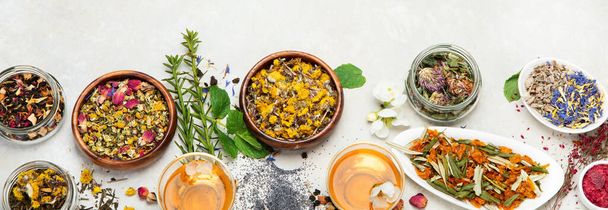 Herbal tea assortment on light background. Traditional healthcare remedies. Top view, flat lay, copy space, panorama - Foto, Imagem
