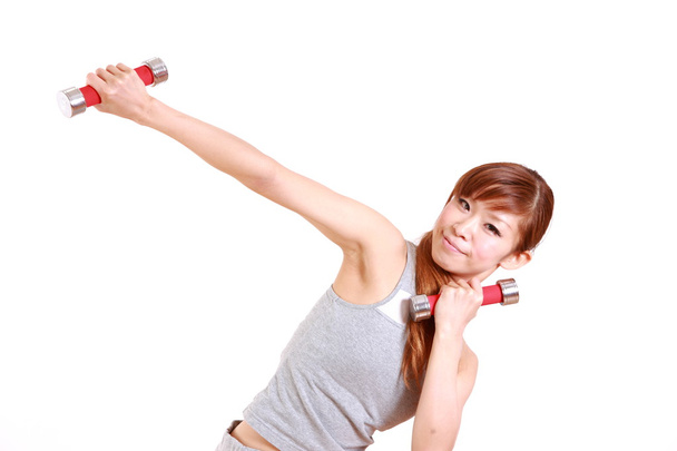 Young Japanese woman doing dumbbell exercises - Photo, Image