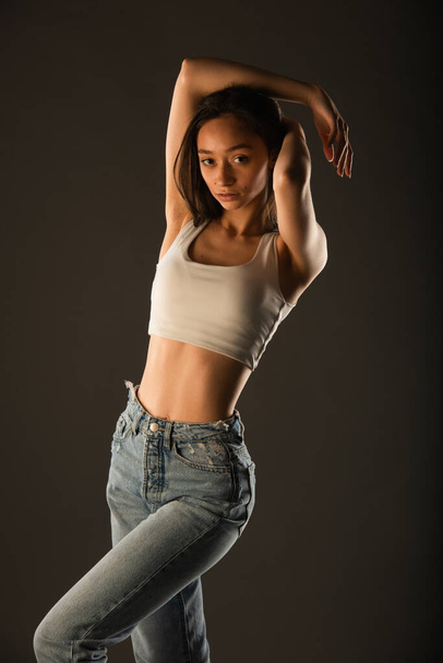 Portrait of sexy and skinny young girl posing in studio - Fotoğraf, Görsel