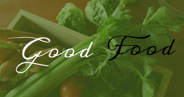 Image of good food text over fresh vegetables. world vegan day and celebration concept digitally generated image. - Foto, Imagen