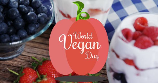 Image of world vegan day text over fresh fruit. world vegan day and celebration concept digitally generated image. - Photo, Image