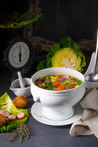 delicious savoy cabbage soup in white vase - Foto, afbeelding