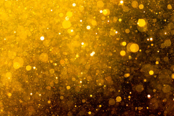 Zlatý bokeh světla texturované třpytky pozadí - Fotografie, Obrázek