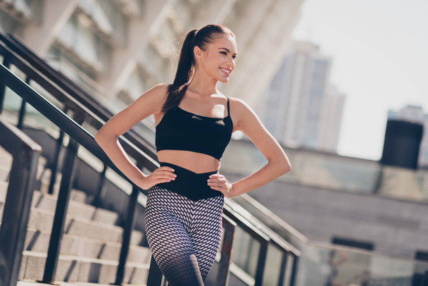 Photo of sporty lady trainer perfect shape figure enjoy dynamic exercise on summer gym outside put hands waist. - Φωτογραφία, εικόνα