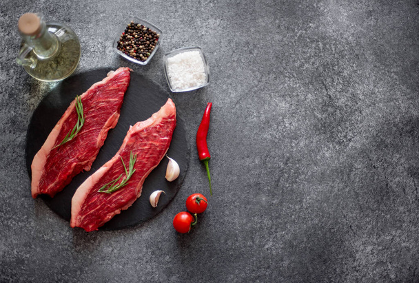 Raw beef steak with ingredients for cooking - Foto, Imagem