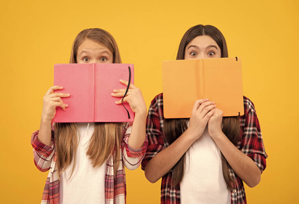 high school. friends girls with notebook. back to school. teens ready to study. happy childhood. cheerful kids going to do homework with books. smiling teenager student. education. - Foto, immagini
