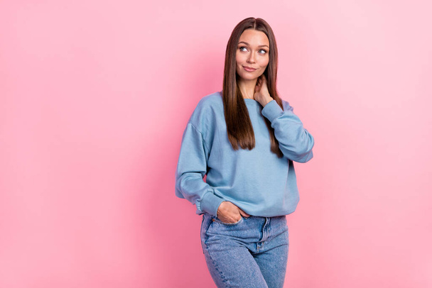 Portrait of attractive cheerful minded girl wearing cosy clothes thinking copy space isolated over pink pastel color background. - Zdjęcie, obraz