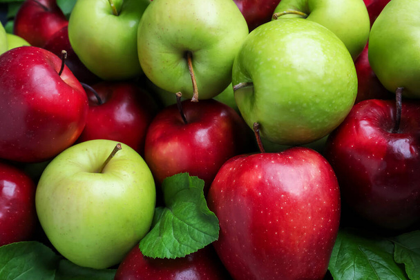 Fresh ripe green and red apples as background, closeup - Fotó, kép