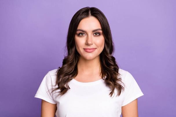 Photo of nice brunette millennial lady wear t-shirt isolated on violet color background. - Photo, Image