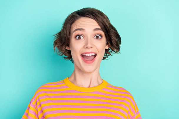 Portrait of attractive cheerful amazed brown-haired girl great news reaction isolated over bright teal turquoise color background. - Фото, изображение