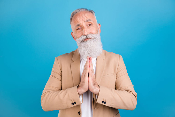 Portrait of handsome classy grey-haired man asking you favor hope luck isolated over bright blue color background. - Fotografie, Obrázek