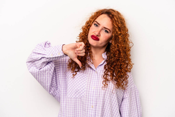Young ginger caucasian woman isolated on white background showing thumb down, disappointment concept. - Foto, Imagem