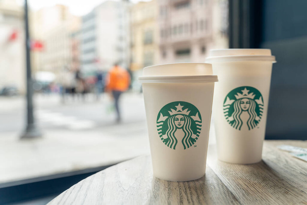 cup of coffee on a table inside the Starbucks in the center of Madrid in Spain - 写真・画像
