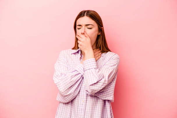 Young caucasian woman isolated on pink background suffers pain in throat due a virus or infection. - Photo, Image