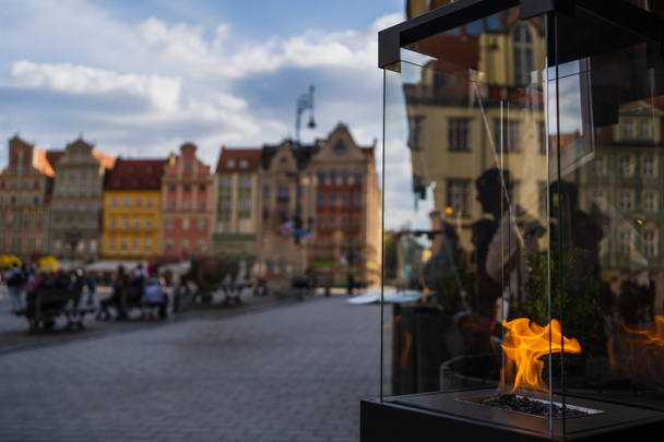 Fire in glass box on urban street in Wroclaw - Zdjęcie, obraz