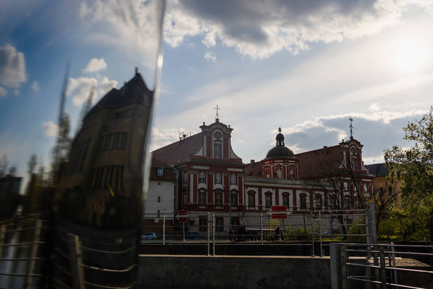 Old buildings of church with cloudy sky at background in Wroclaw - Photo, Image