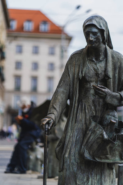 WROCLAW, POLAND - APRIL 18, 2022: Bronze Anonymous Pedestrians memorial on urban street  - Zdjęcie, obraz