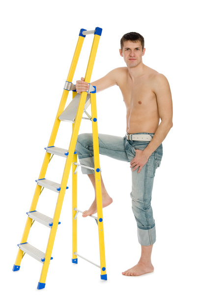 Young man with a stand ladder. - Φωτογραφία, εικόνα