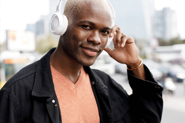 black afro man with headphones portrait outdoor. High quality photo - Photo, Image