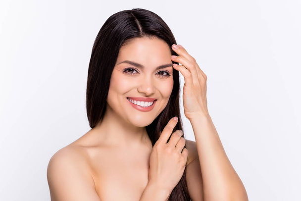 Photo of young attractive woman happy positive smile hands touch hair salon procedure isolated over grey color background. - Photo, Image