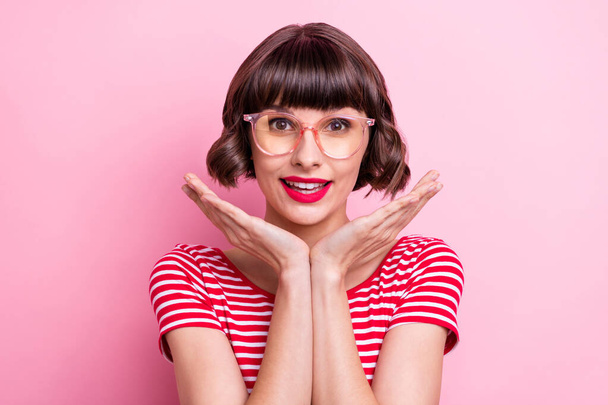 Photo portrait girl in spectacles smiling pretty hands near face isolated pastel pink color background. - Фото, зображення